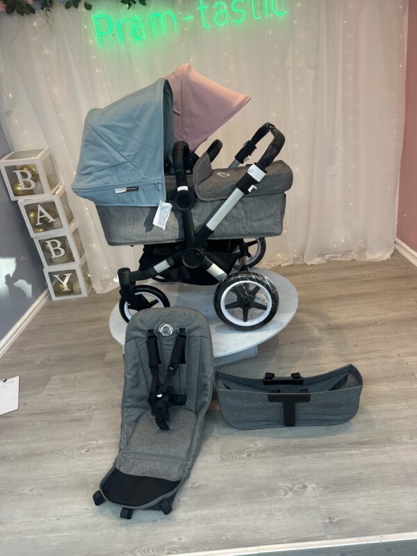 Bugaboo Donkey 3 in soft pink and blue with pram tastic background